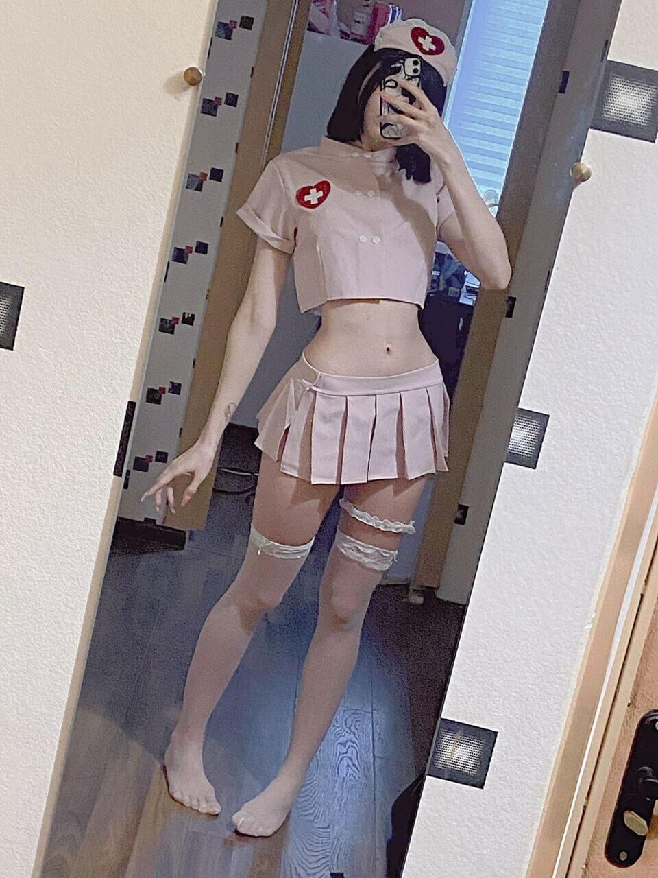 Petite asian teen slut cosplaying as a nurse with pantyhose, mini skirt and t-shirt revealing tummy and skinny small body